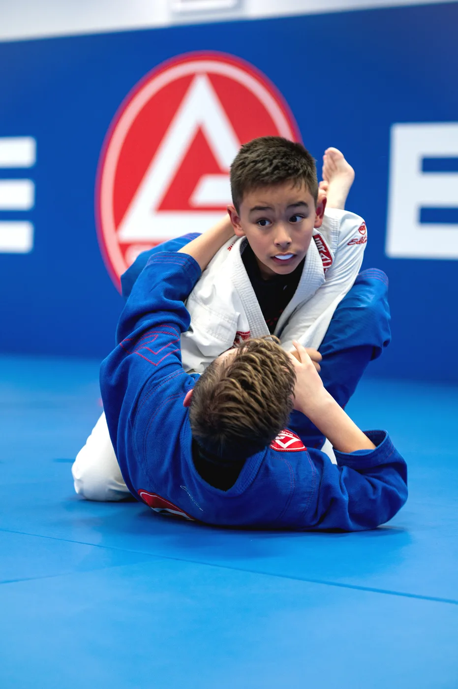 Two children practising a guard position at Gracie Barra Holbrooks