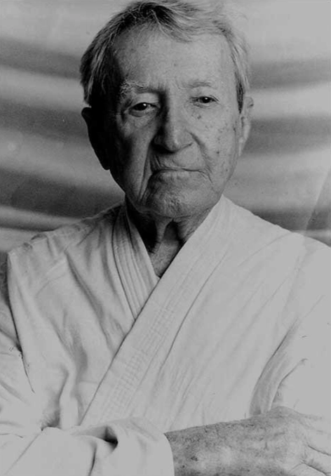 Master Carlos Gracie Sr in a gi, looking to camera