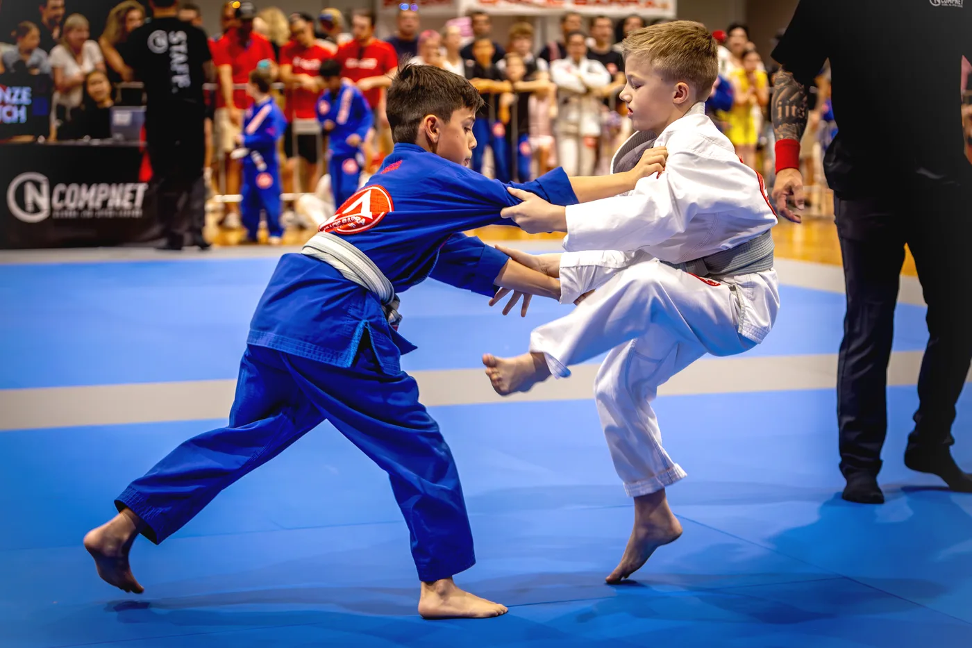 Two children taking part in a Jiu-Jitsu match