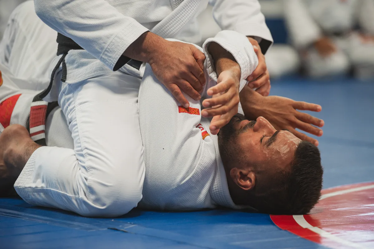 Two adults practising a Jiu-Jitsu technique